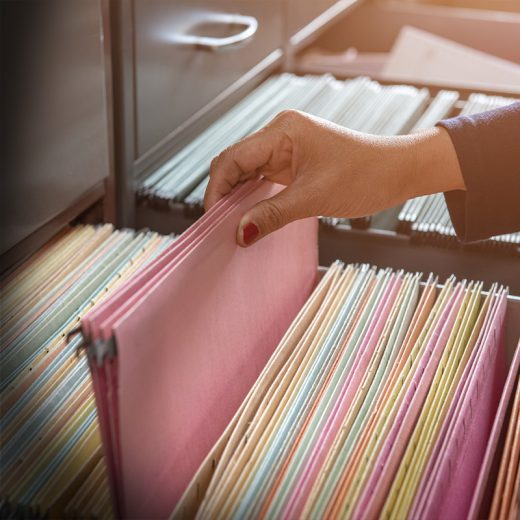 Person grabbing files