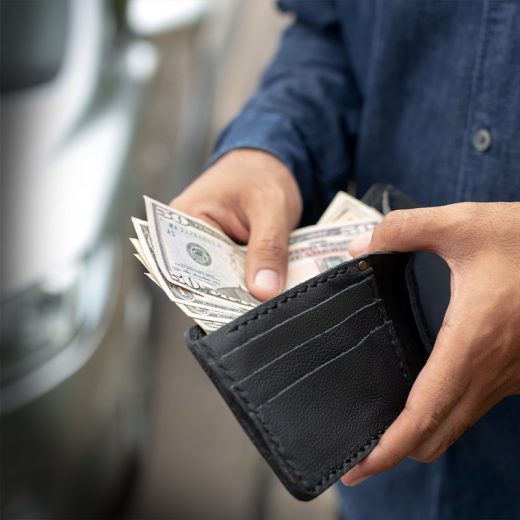 Person grabbing money out of wallet